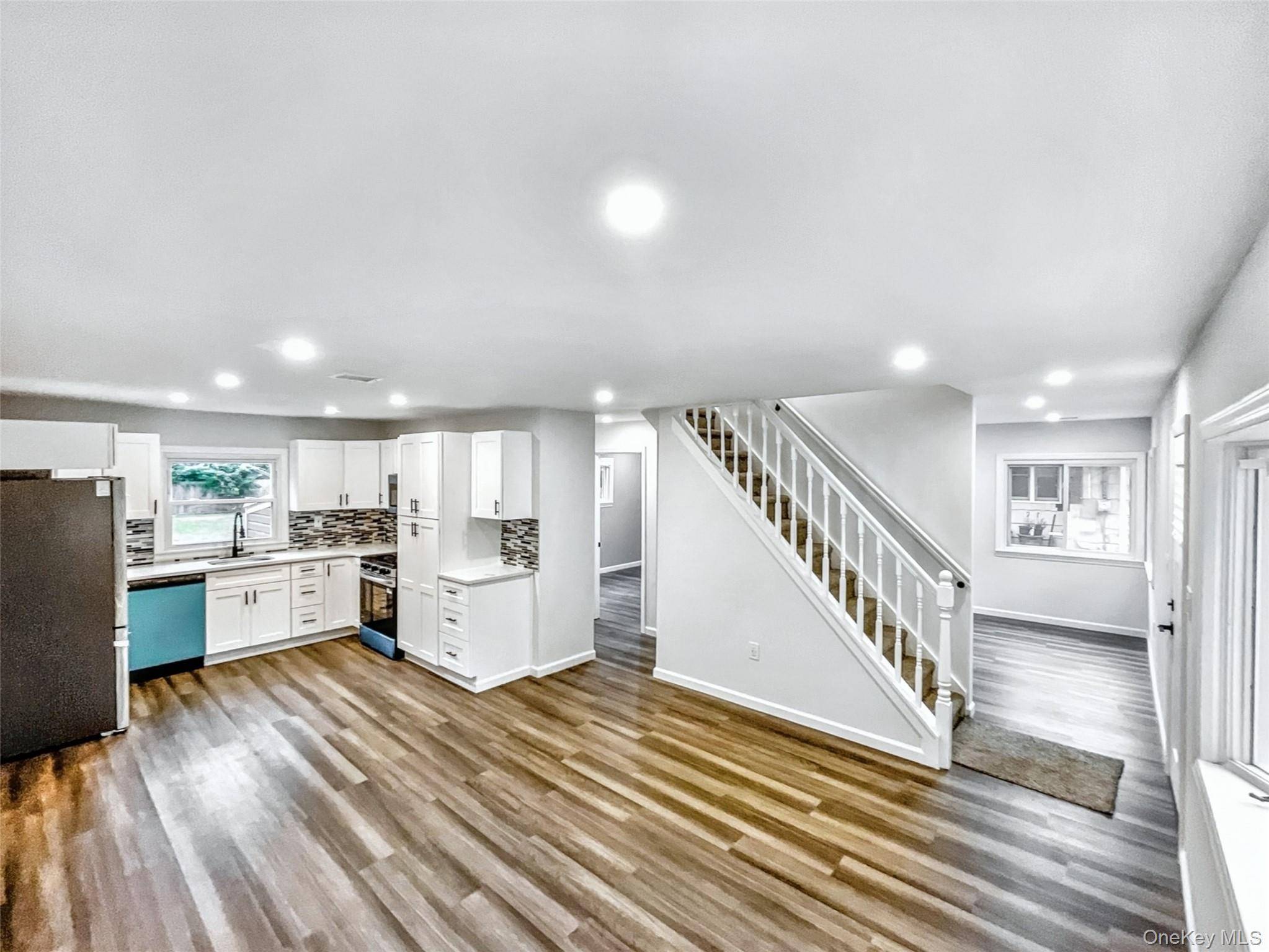 Welcome to 20 Hounslow Rd in Shirley, NY a modern, energy conscious two story home designed for comfort, sunlight, and sustainable living.