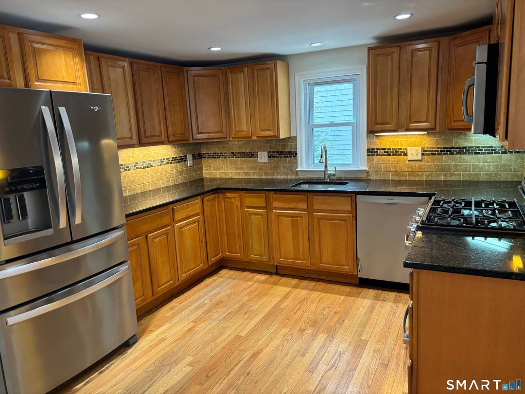 Charming Cape on Quiet Cul de sac with Modern Updates.