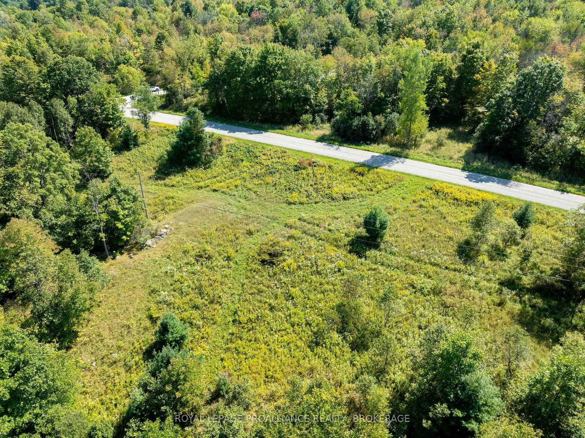 Country property with 5 acres of land and 825 feet of road frontage along the north side of Crozier Road.