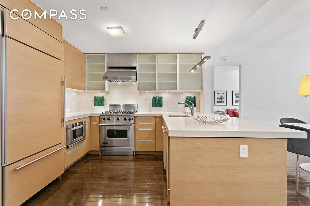 Residence 5A at the boutique Hudson Hill Condominium is a pristine true 3 bedroom, 2.