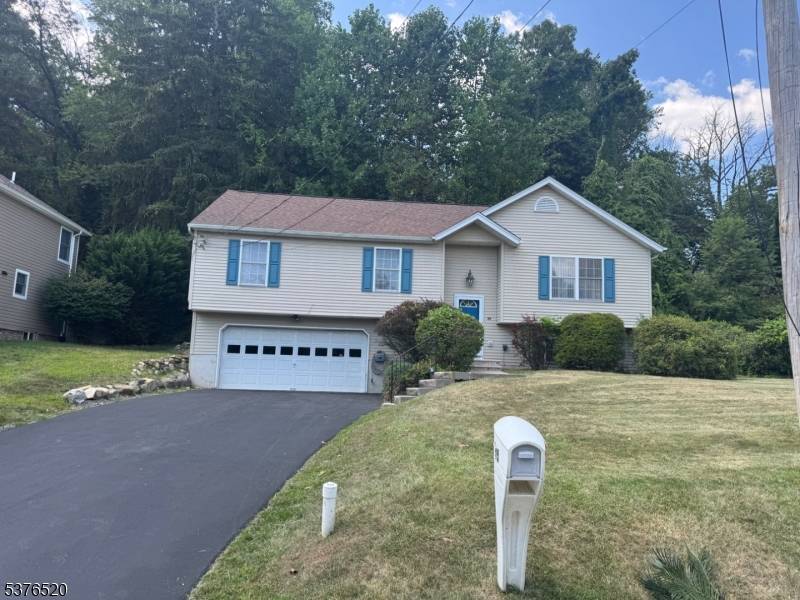 Bi Level home boasts New Kitchen w State of the Art Stainless Appliances, Access this Private backyard thru the Dining Room sliders to the Deck situated on Beautiful Wooded Backyard, ...
