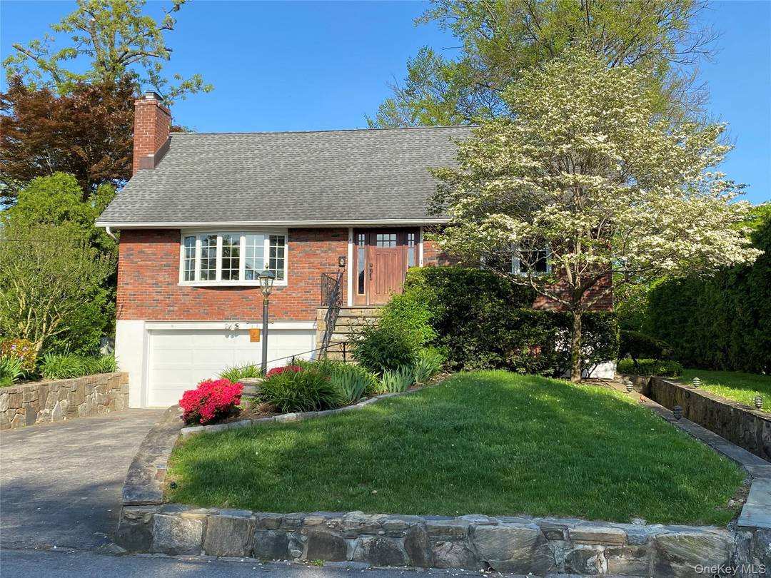 Updated and spacious Cape located on a lovely tree lined street in the desirable Leewood area of Eastchester.