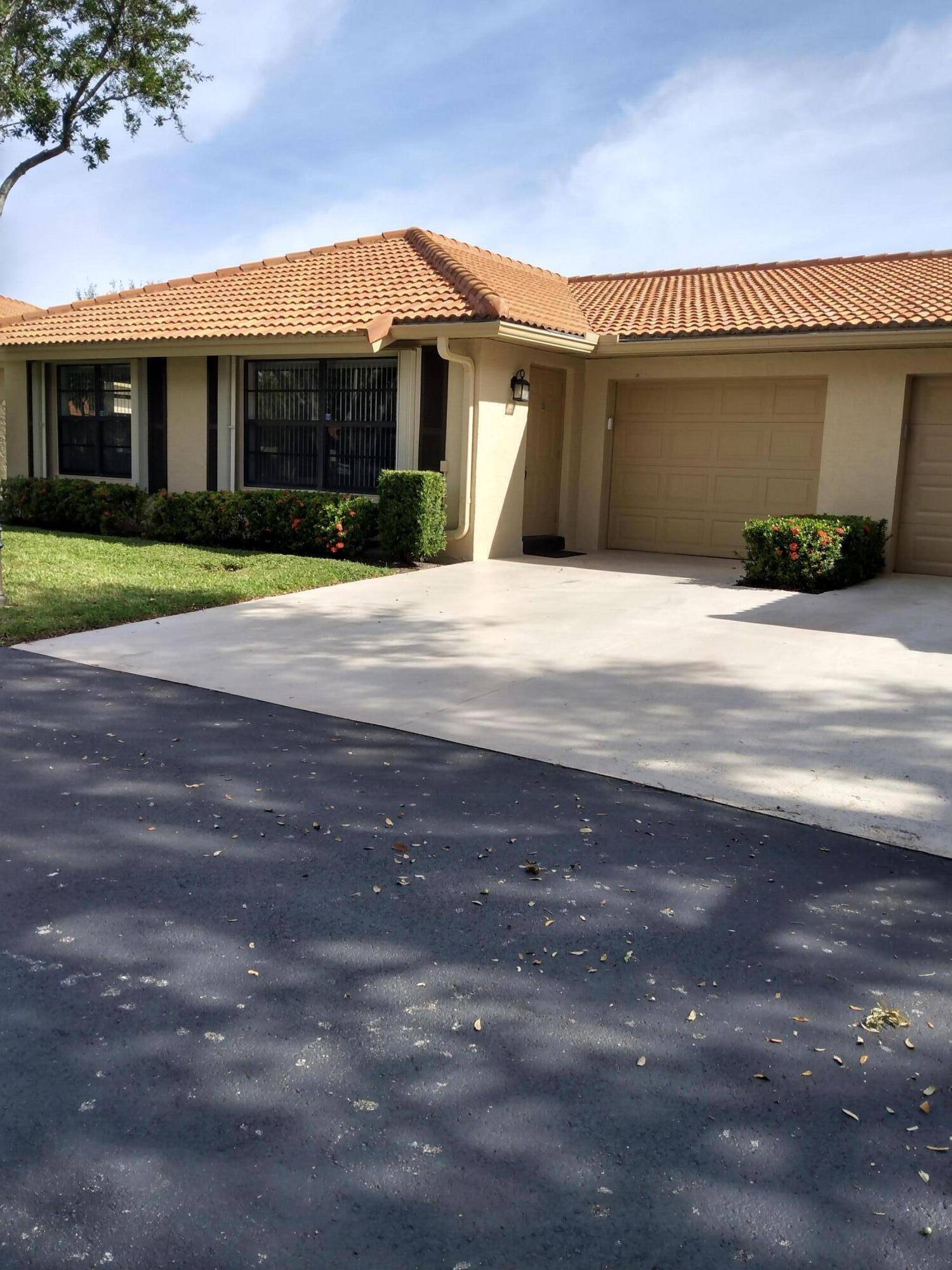 Open and spacious floor plan with updated wooden kitchen and bathroom cabinets.