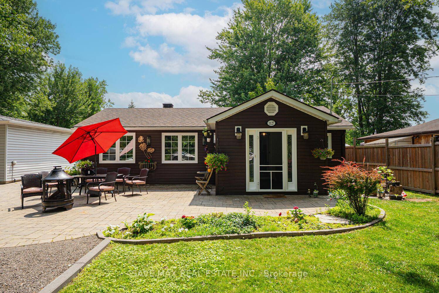 Nestled in the charming waterfront community of Gilford, this beautifully renovated bungalow is a true gem.