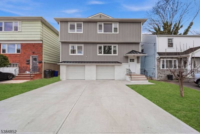 this stunning multi family home in desirable Hillside offers modern living with exceptional quality throughout.