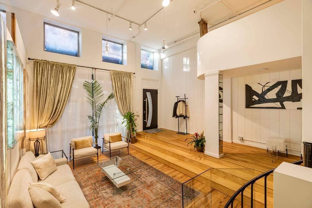 WELCOME TO THIS EXTRAORDINARY 3 LEVEL SOHO LOFT !