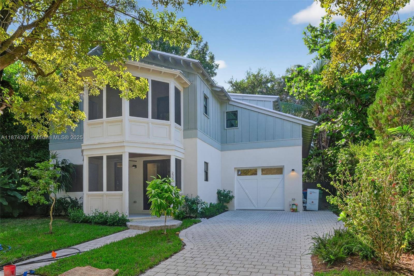 A rare treasure, this brand new home was thoughtfully designed by renowned architect Luigi Vitalini to blend timeless Coconut Grove character with modern comfort.