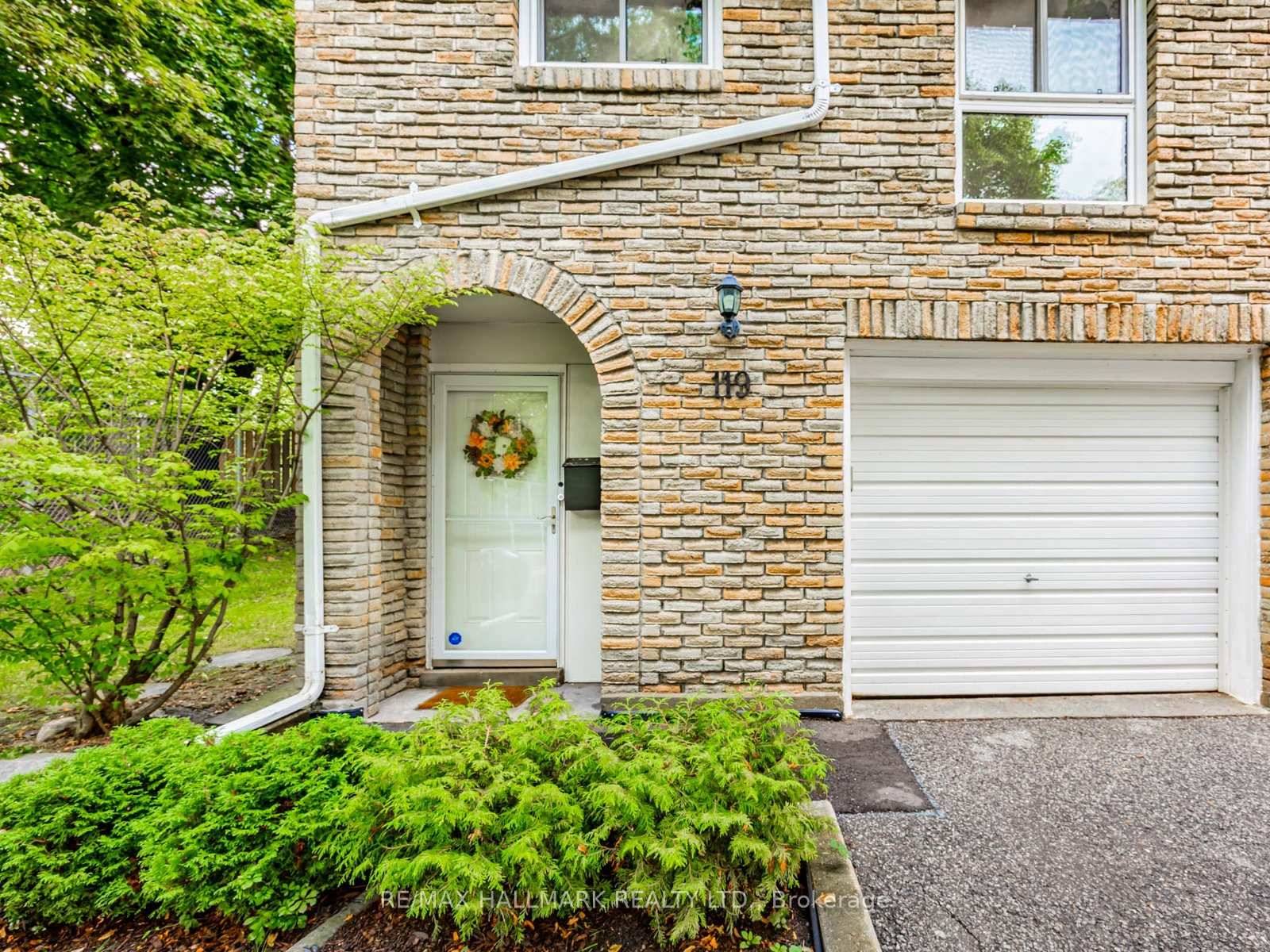 End unit townhouse in Bayview Village with a stunning living room showcasing soaring high ceilings, oversized windows, and abundant natural light.