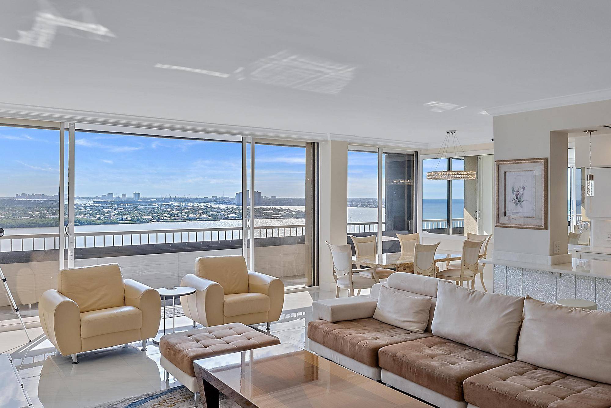 Experience coastal luxury in this exceptionally renovated Singer Island residence, with sweeping ocean and Intracoastal views that stretch to Palm Beach Island.