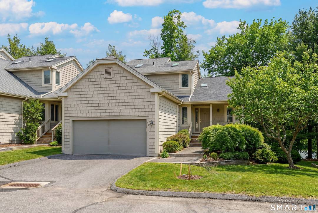 Lake Place.... Largest model end unit with primary suites on the main and upper levels.