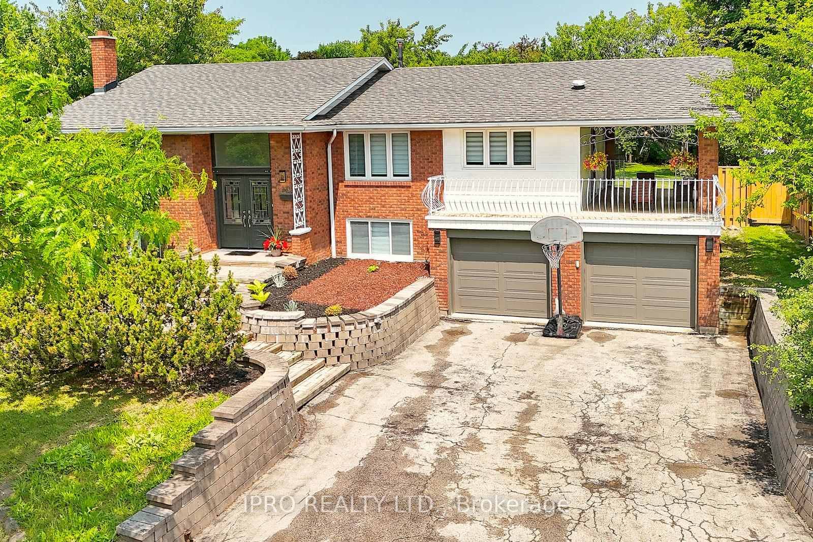 Welcome to this spacious, bright, carpet free custom built raised bungalow on a huge oversized corner lot.