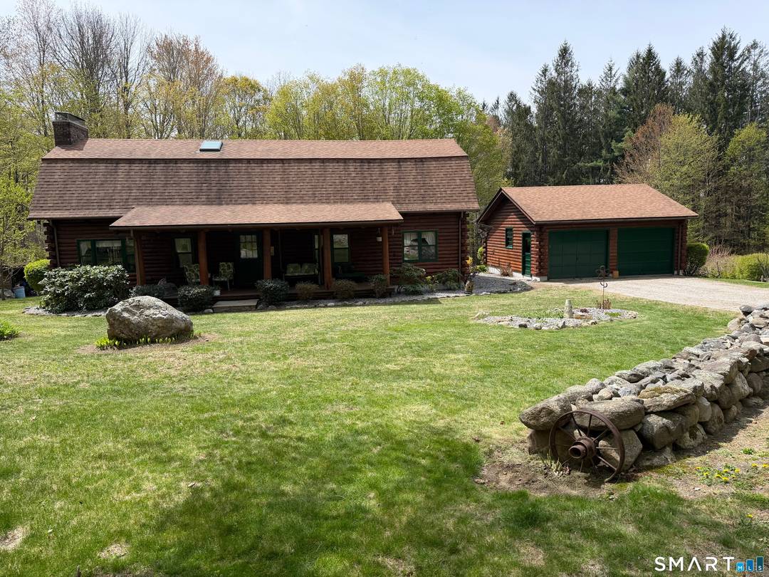 Nestled in a peaceful setting, this log home captures the warmth and character of a thoughtfully updated two level retreat.