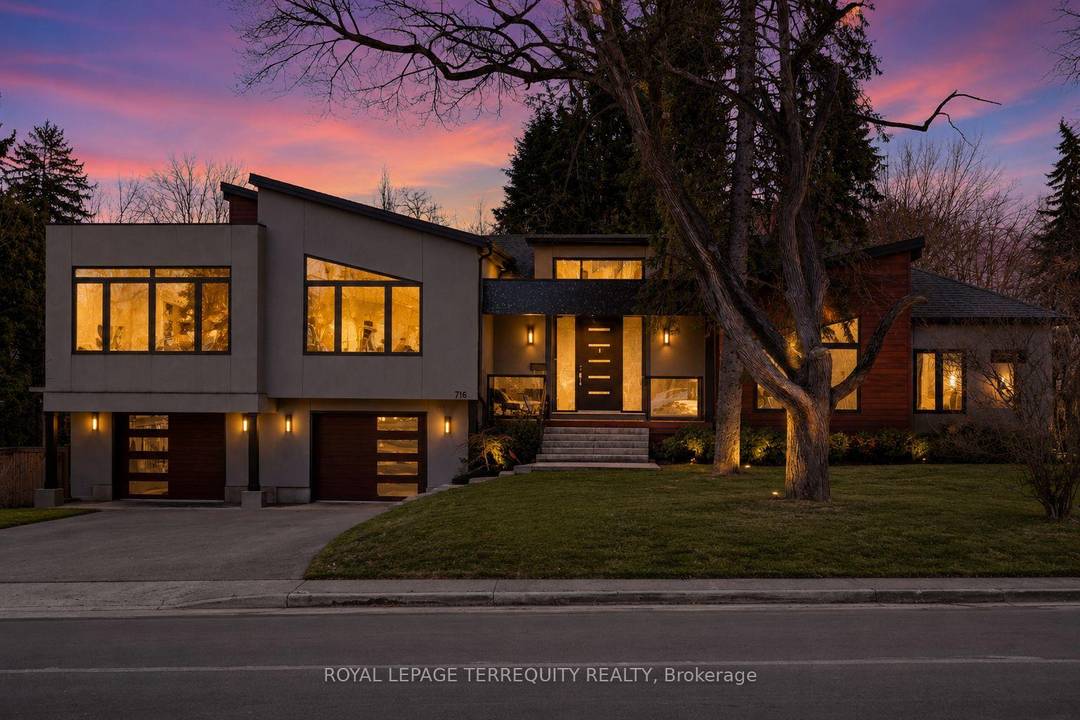 Welcome to 716 North Shore Blvd E, a custom residence set within one of Burlington's most prestigious pockets.