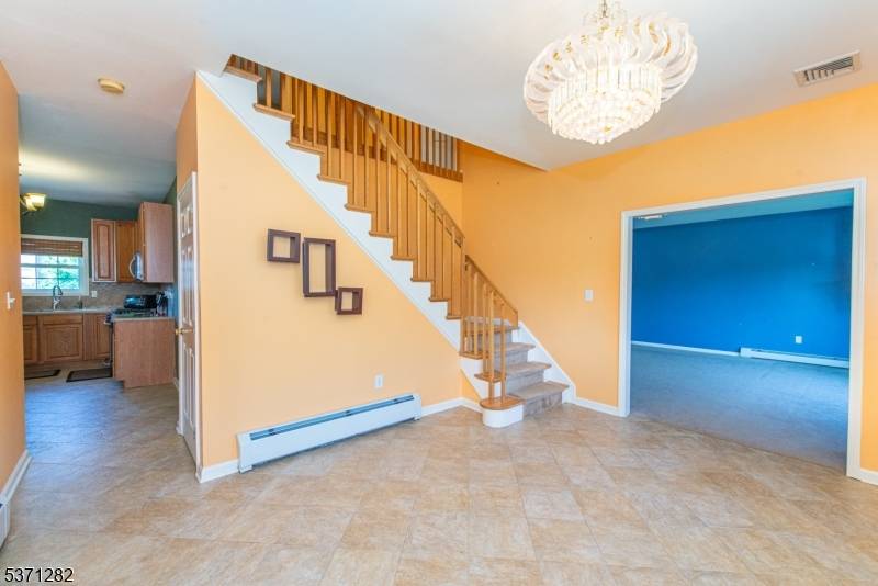 Welcome to this stunning 5 bedroom, 3 bath Custom Colonial in the desirable Village on the Ridge !