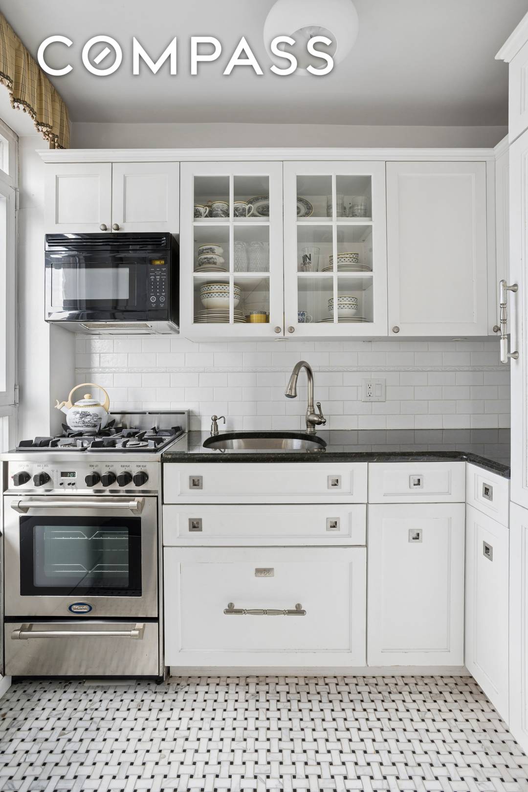 Step into this sun drenched, south facing residence through a gracious entry foyer that opens into an expansive living and dining area.