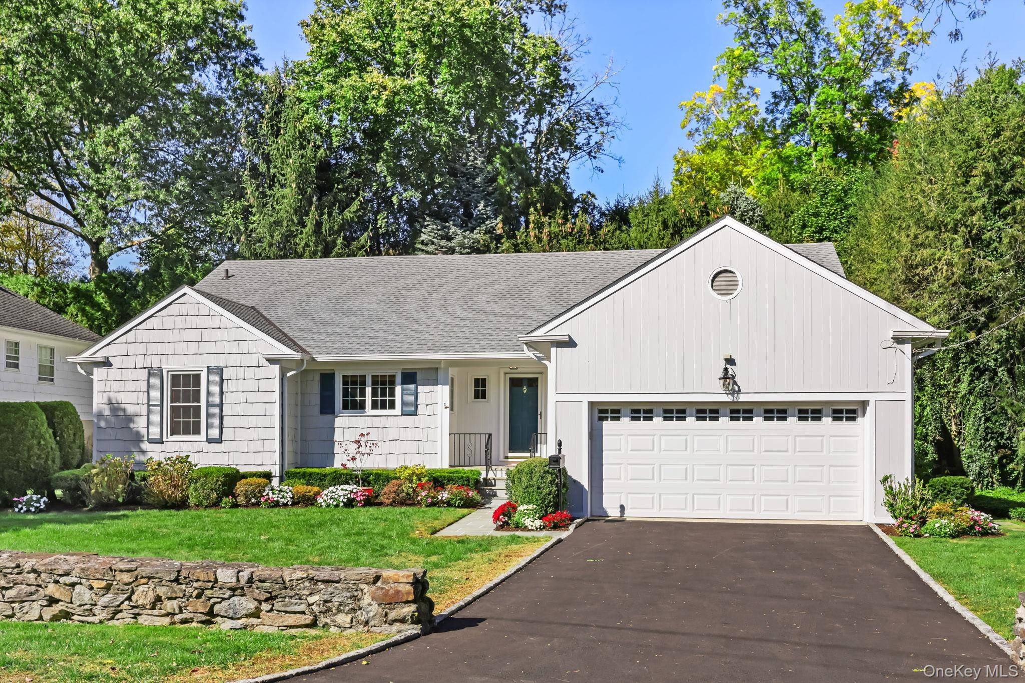 Bright and sunny Cape style home perfectly set on one of the best streets in Greenacres !