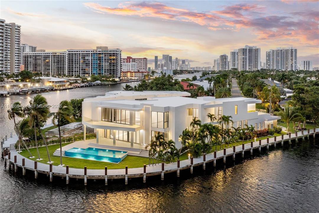 Nestled within the exclusive guard gated waterfront enclave of Golden Isles in Hallandale Beach, this residence is a true statement of architectural excellence.