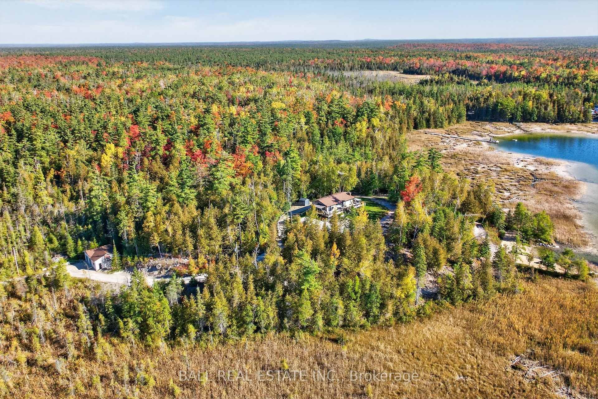 Escape to your own private paradise on Little Silver Lake with this charming move in ready bungalow nestled on 6.
