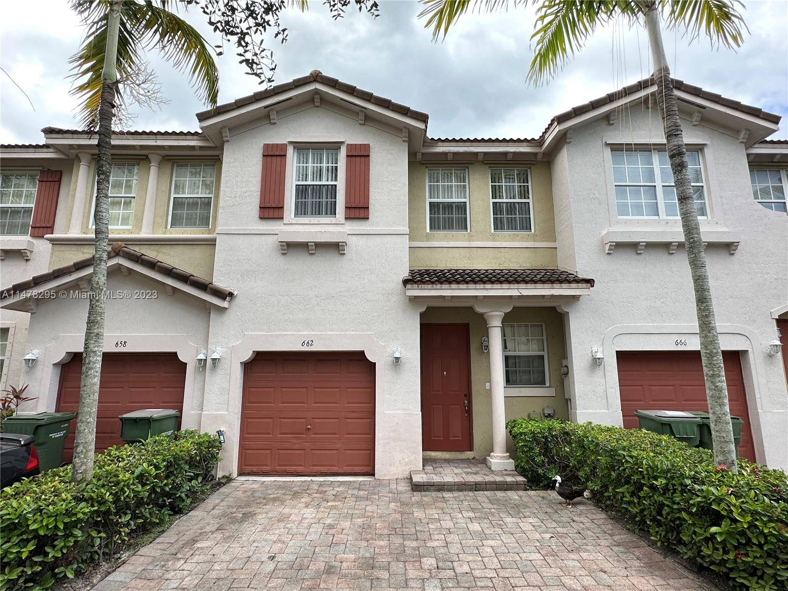 Serene 3 bedroom, 2 1 2 bath lakefront Mediterranean inspired home centrally located in Portofino West, a private gated townhome community in Homestead.