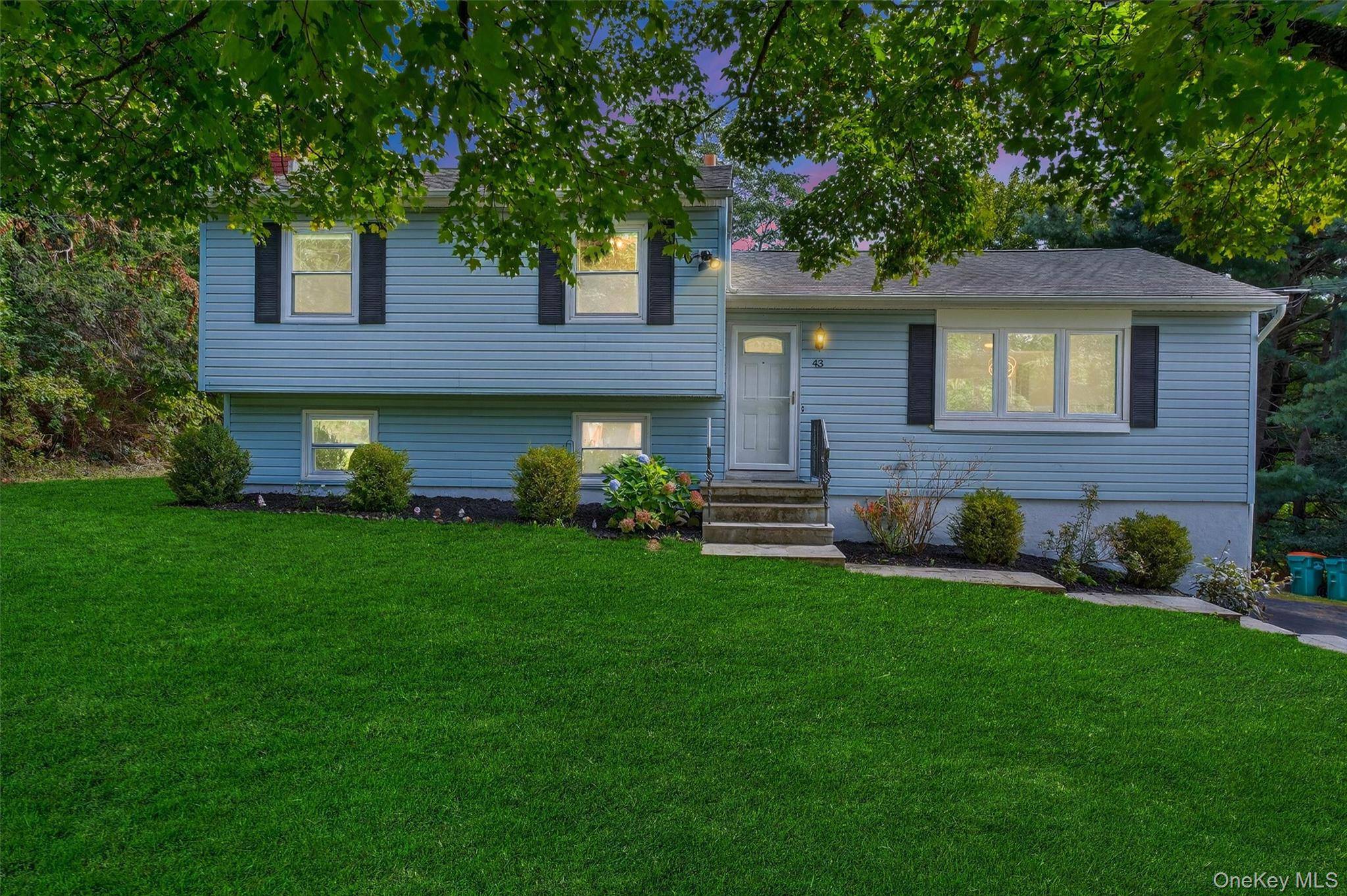 This charming split level features four spacious bedrooms and one and a half bathrooms, offering plenty of room for comfortable living.