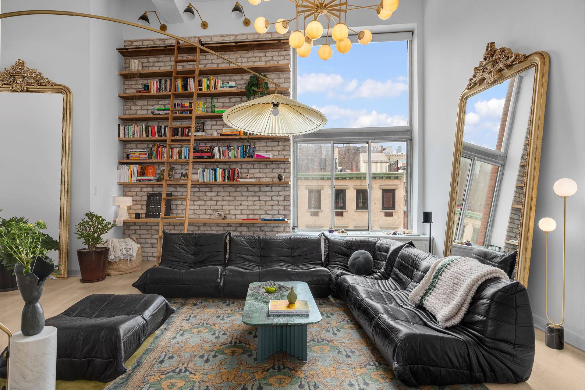 Modern design meets historic charm in this impeccably renovated and exquisitely furnished duplex loft.