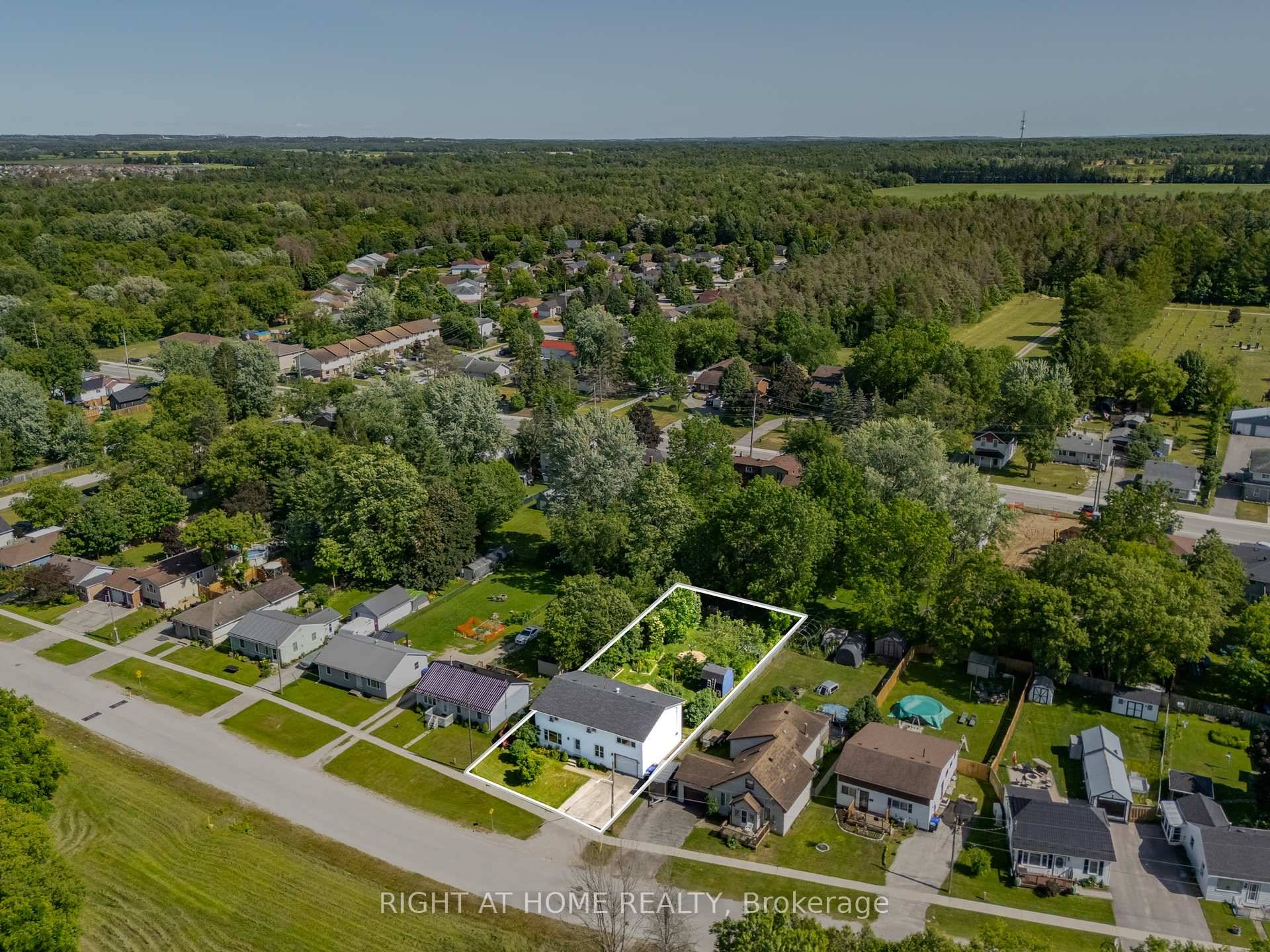 This five bedroom detached home offers over 2, 000 square feet of space on a large, well maintained lot with mature perennials and trees.