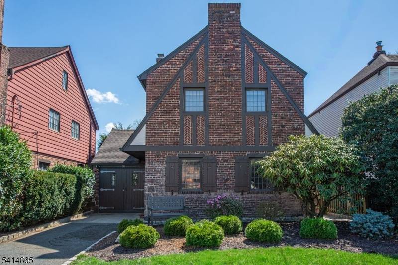 Situated on one of the prettiest streets in the Allwood section is this charming brick Tudor with amazing curb appeal !