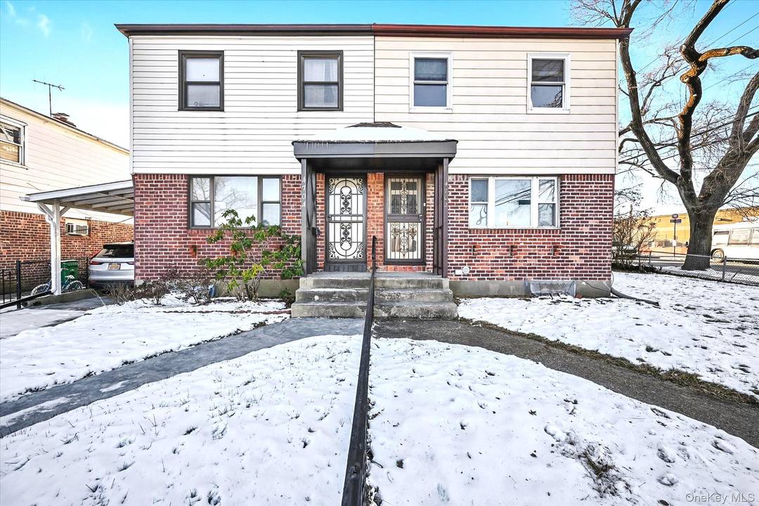 Semi detached Bayside colonial on a corner lot in highly rated School District 26.
