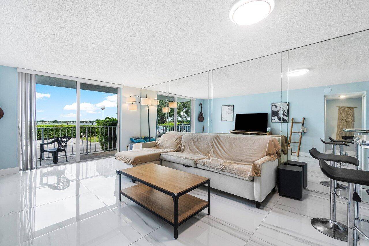 Enjoy beautiful lake views from this spacious 1 bedroom, 1 bath condo on the first floor of a gated community in West Palm Beach.