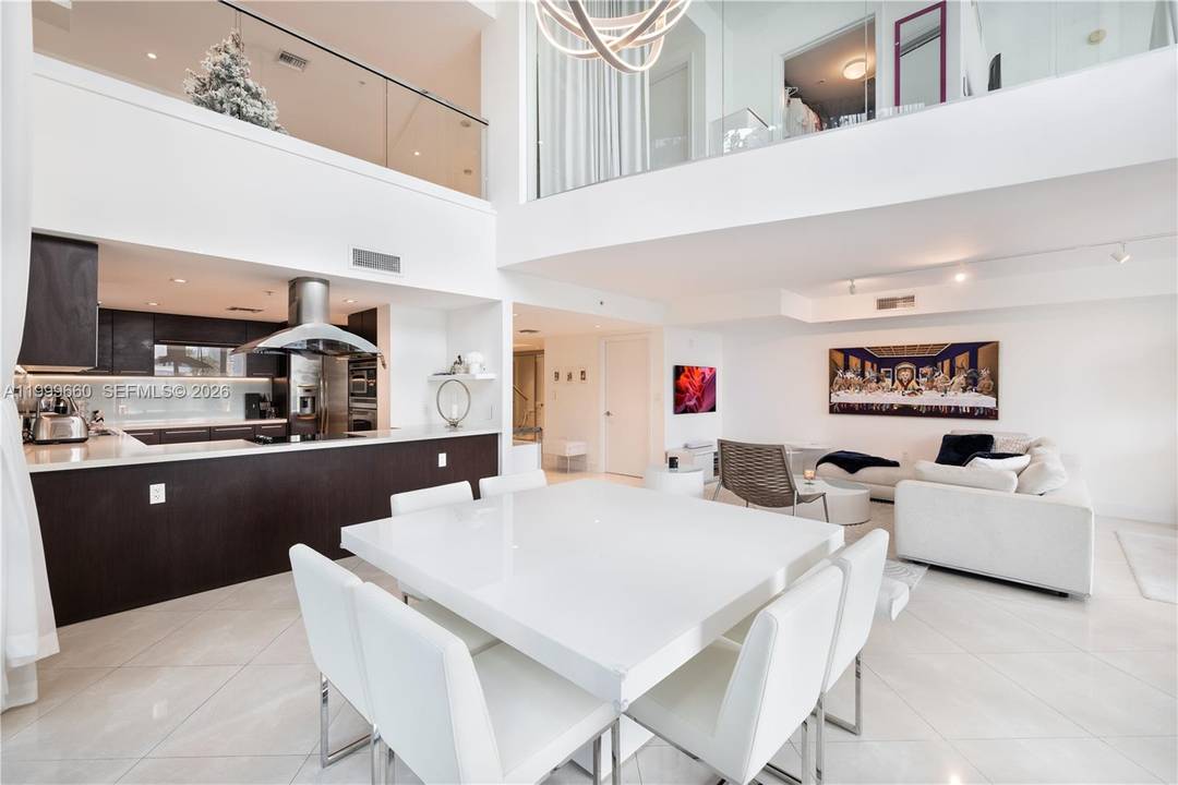 A rare offering at Eloquence on the Bay, this two story waterfront residence delivers the privacy and scale of a single family home within a discreet condominium setting.