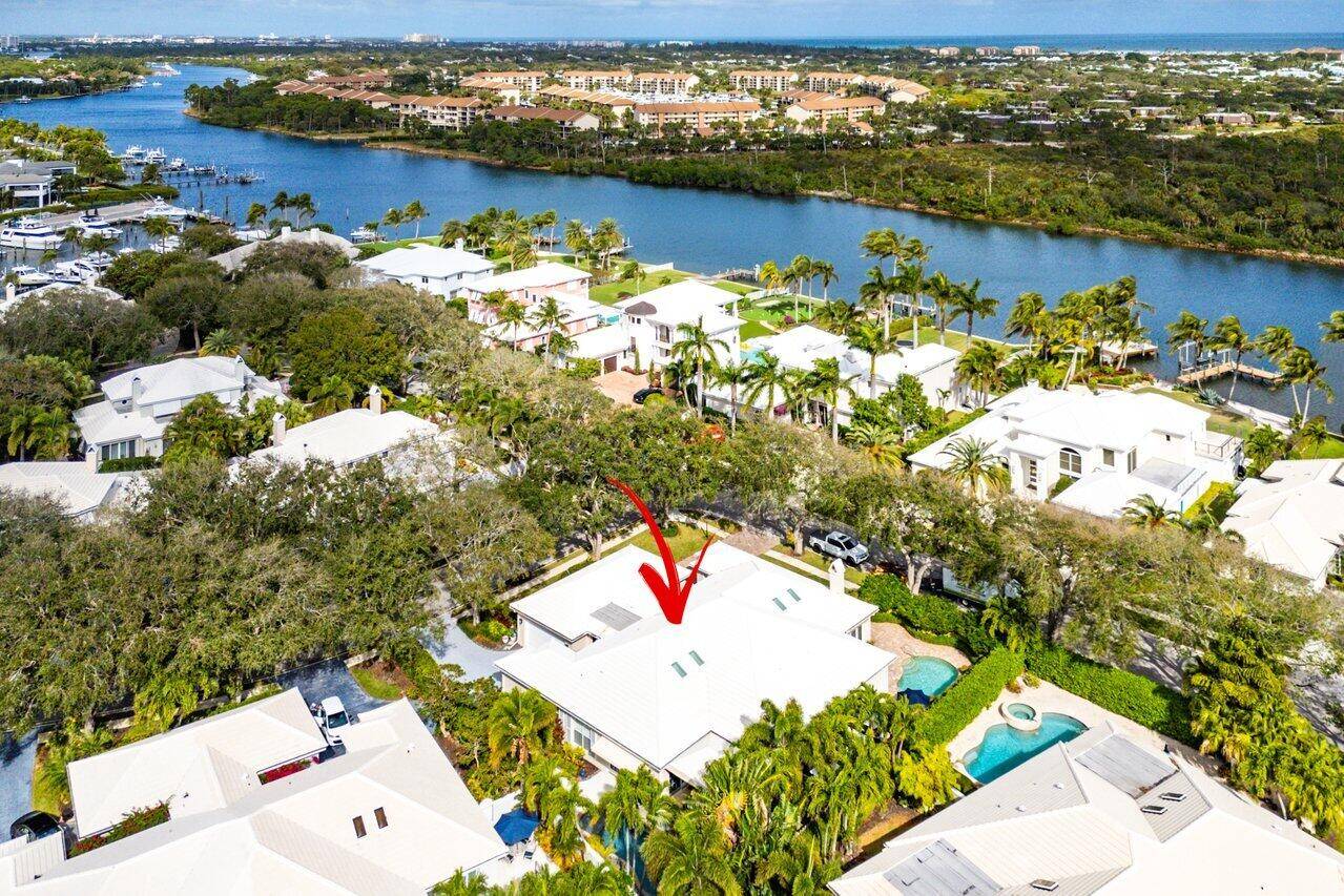 Experience luxury living in this completely remodeled, sun filled single story home in the exclusive, gated waterfront community of Cypress Island.