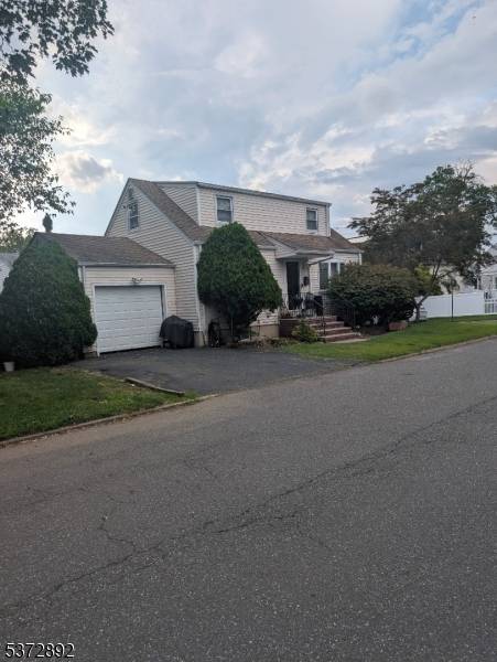 Lovely fixer upper with great potential, eat in kitchen, driveway, and garage for easy parking.