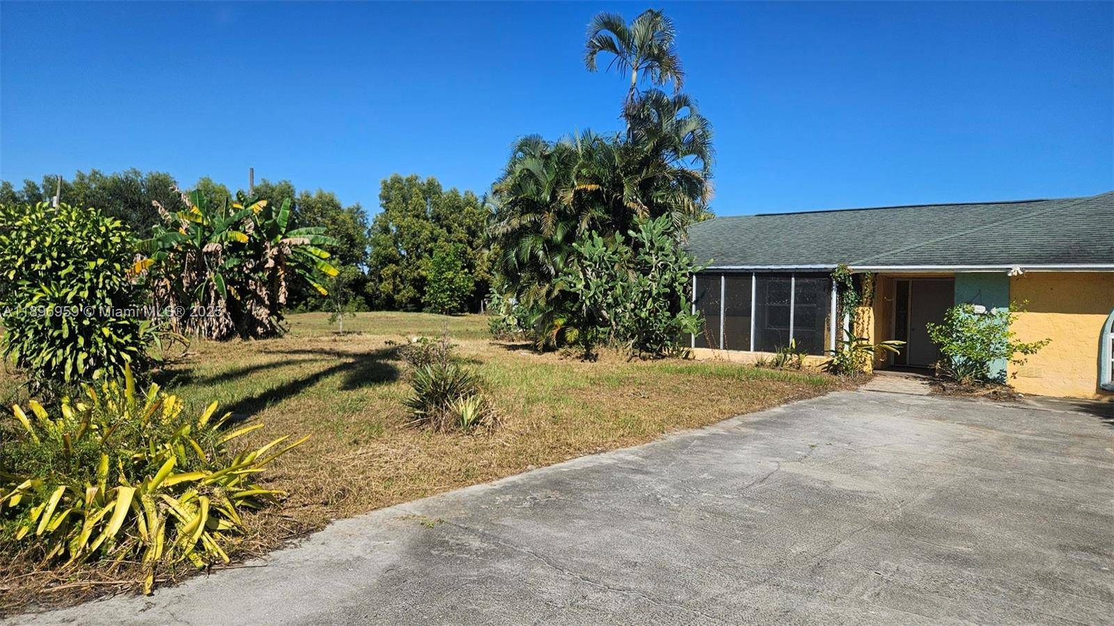 Situated on almost 5 beautiful acres, this Naples property offers a rare opportunity to create your dream estate.