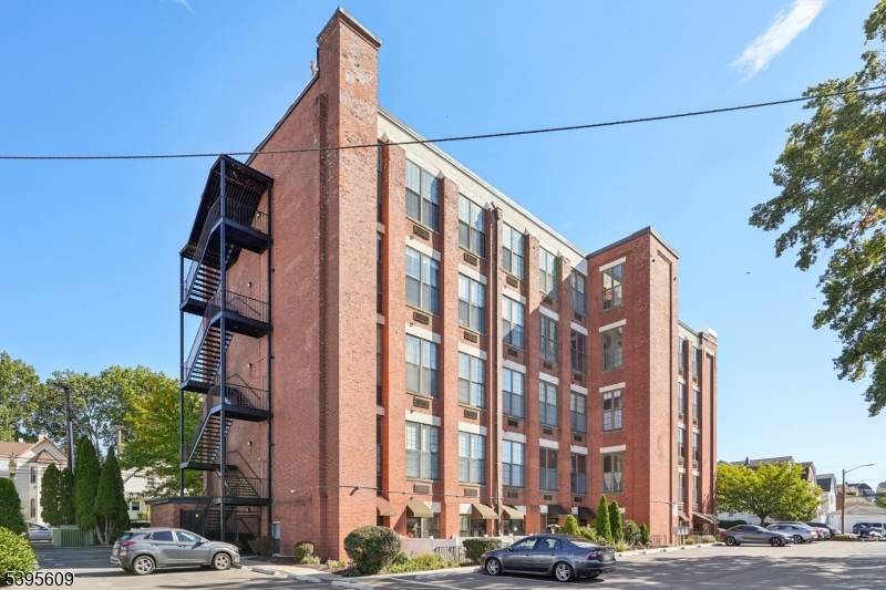 Welcome home to this distinctive 2 bedroom 2 bathroom 5th floor Condo located in the sought after Loft Commons of Paterson's desirable Lakeview section.