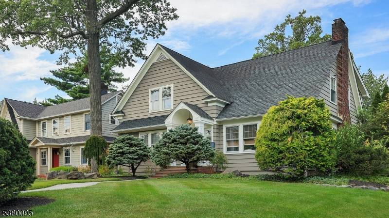 This four bedroom, two full and two half bath Craftsman Colonial blends timeless character with thoughtful updates for today's lifestyle.