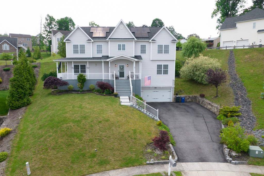 Ridge Top Knoll is sited on a beautifully landscaped and improved lot with mature landscaping and mountain views.