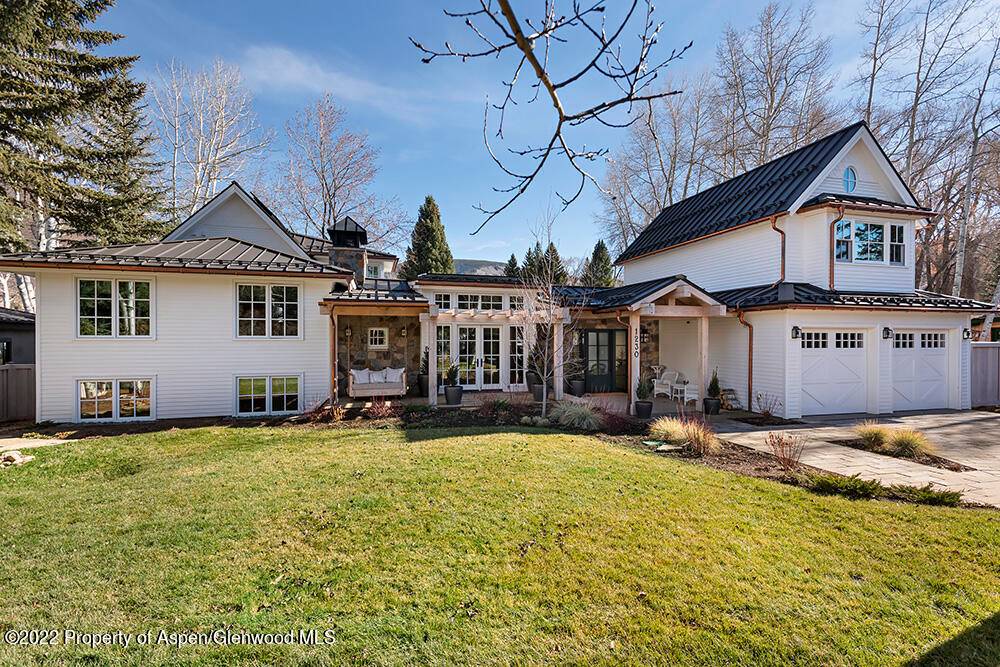 Completely transformed from a 1970s era split level dwelling to a traditional, Dutch colonial inspired design that charms throughout.