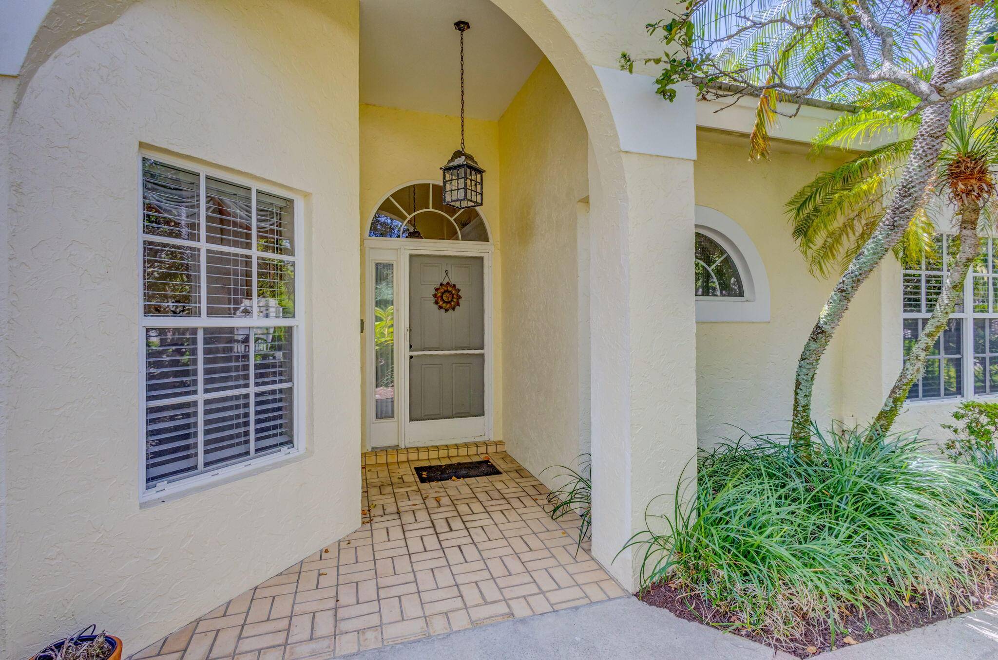 Discover your dream home in the sought after neighborhood of Riverwind, a gated enclave within the prestigious Jonathan's Landing community.