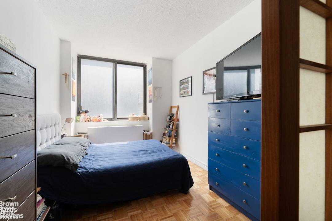 Welcome to this beautifully designed Upper East Side studio, thoughtfully converted into a one bedroom oasis with elegant Japanese sliding shoji doors that create both serenity and privacy.