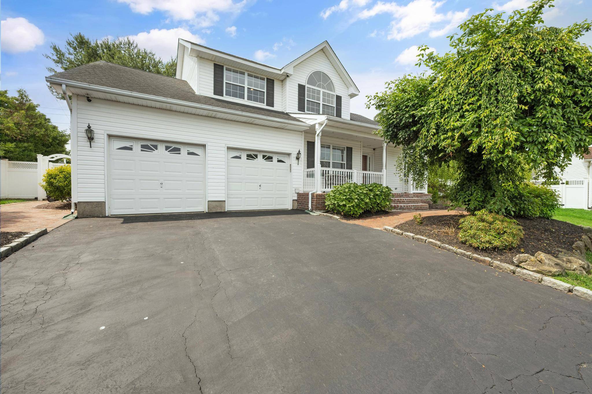 Welcome to this beautifully updated Colonial style home, ideally located on a prime cul de sac in the sought after Country Estate development, within the award winning Commack School District.