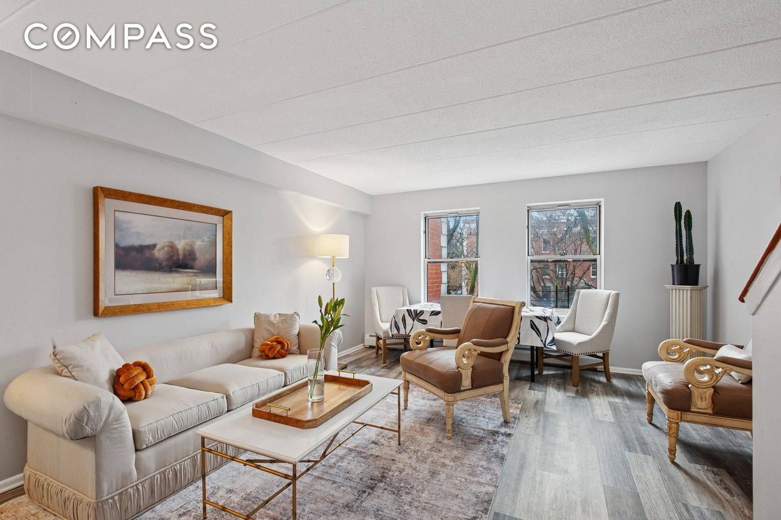 This beautifully refreshed two bedroom, one and a half bathroom duplex in the St.