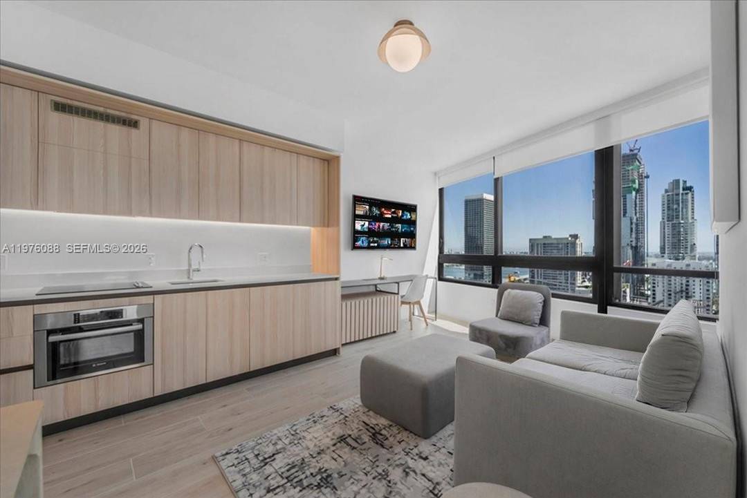 Wake up to panoramic views of the Miami skyline and Biscayne Bay from this fully furnished one bedroom residence at District 225.