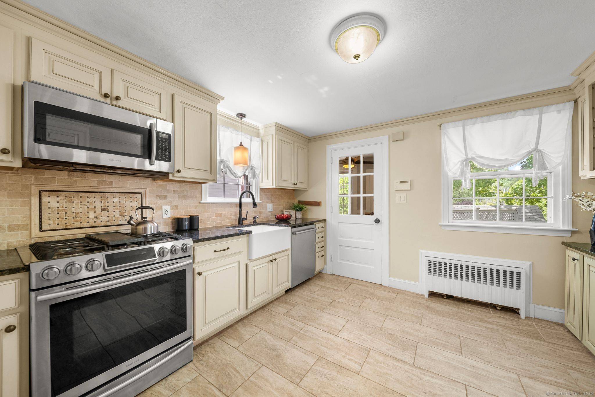 101 N Main is a charming colonial that sits behind a fieldstone wall just four blocks from West Hartford center !