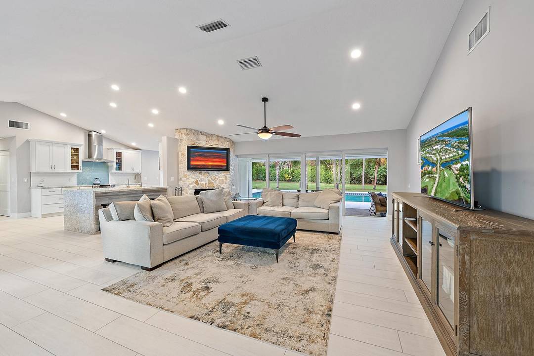 EXQUISITE four bedroom, three bathroom single family home nestled on over an acre of lush, tropical land in one of Jupiter's most serene and sought after communities.