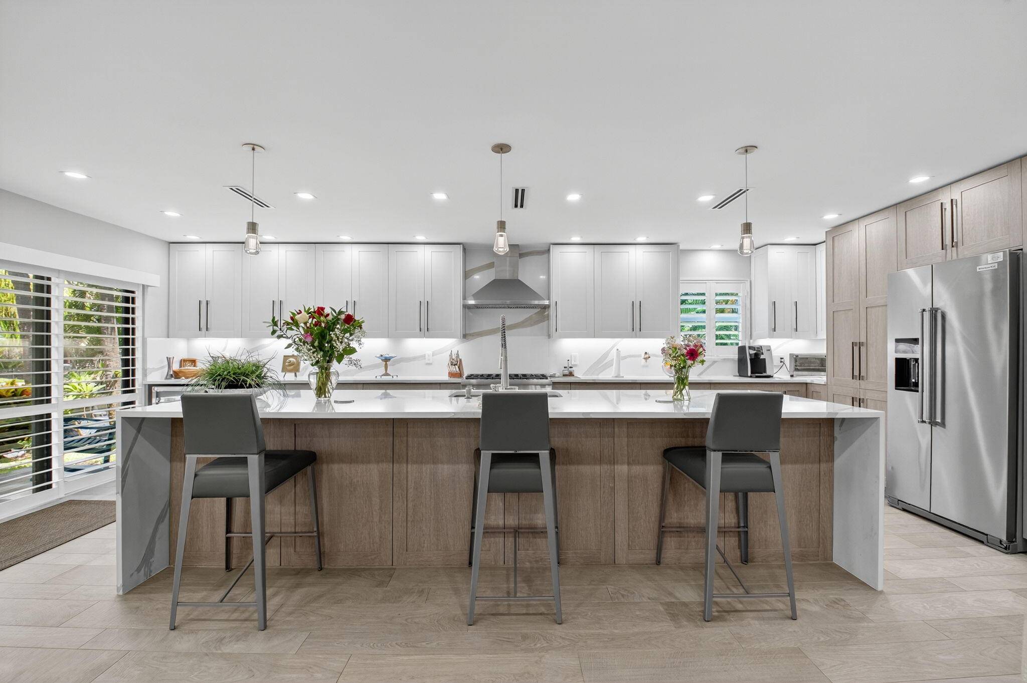 This stunning, fully renovated condo offers luxurious coastal living with designer finishes and a sleek, modern aesthetic.