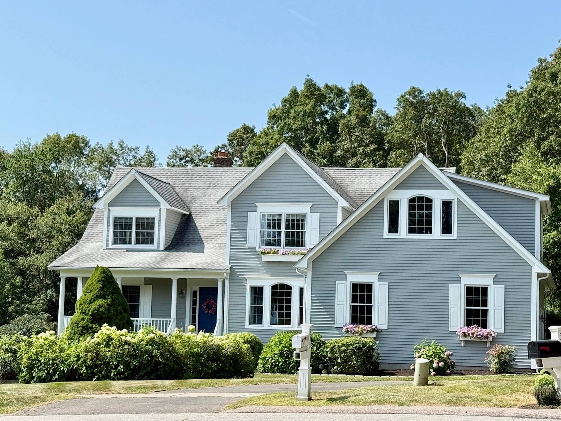 ENCHANTING 11 room home, nestled on a pretty, lushly landscaped 1.