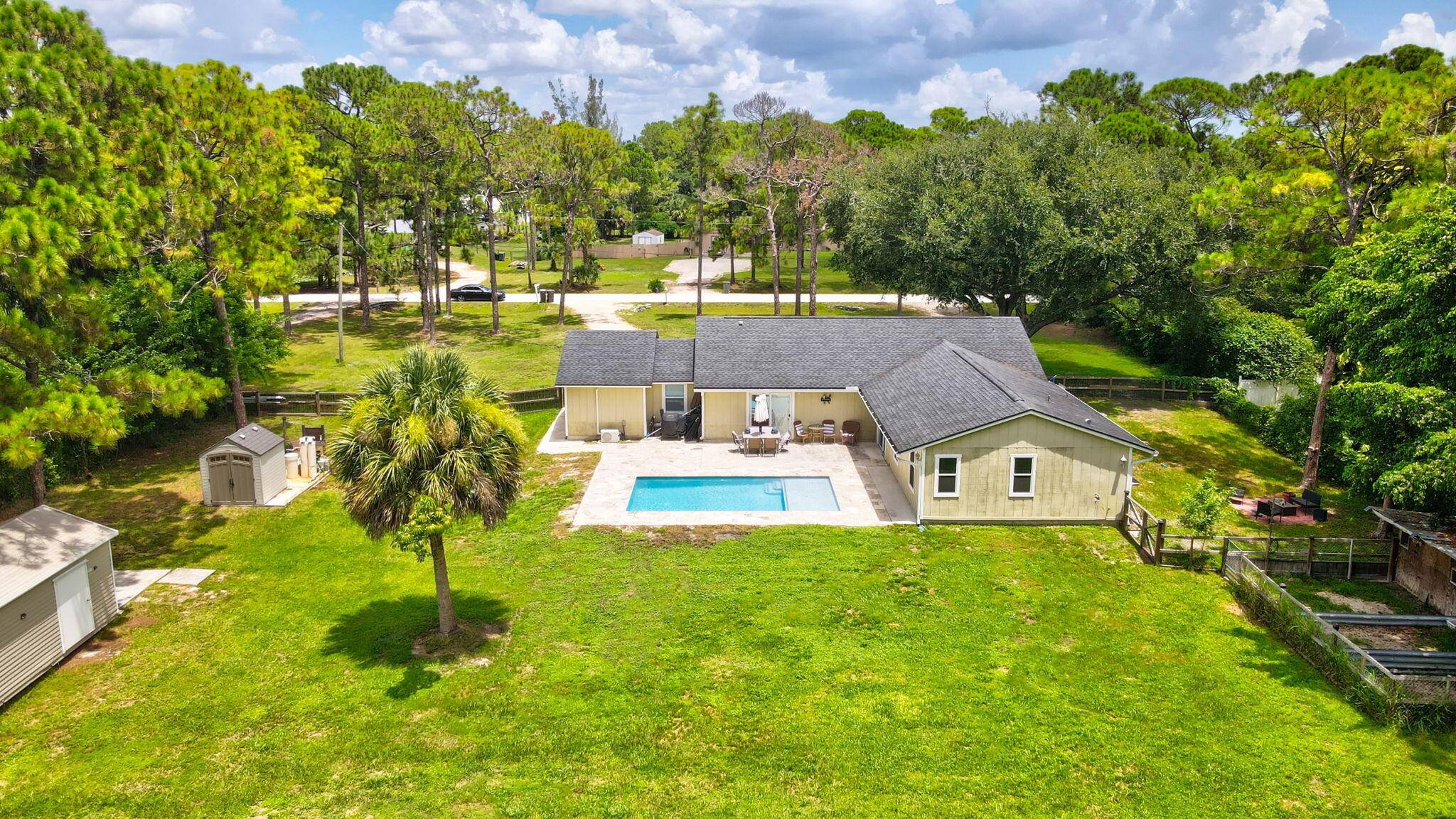 Discover the perfect blend of space, style, and serenity in this beautifully updated 5 bedroom, 3 bathroom home, set on a sprawling 1.