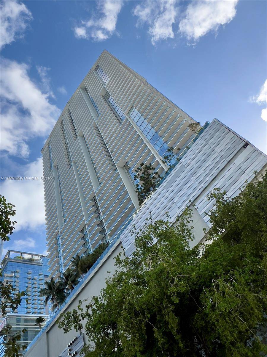 Step into elevated elegance with this impeccably furnished, 1, 265 sq ft corner residence at Reach, Brickell City Centre.