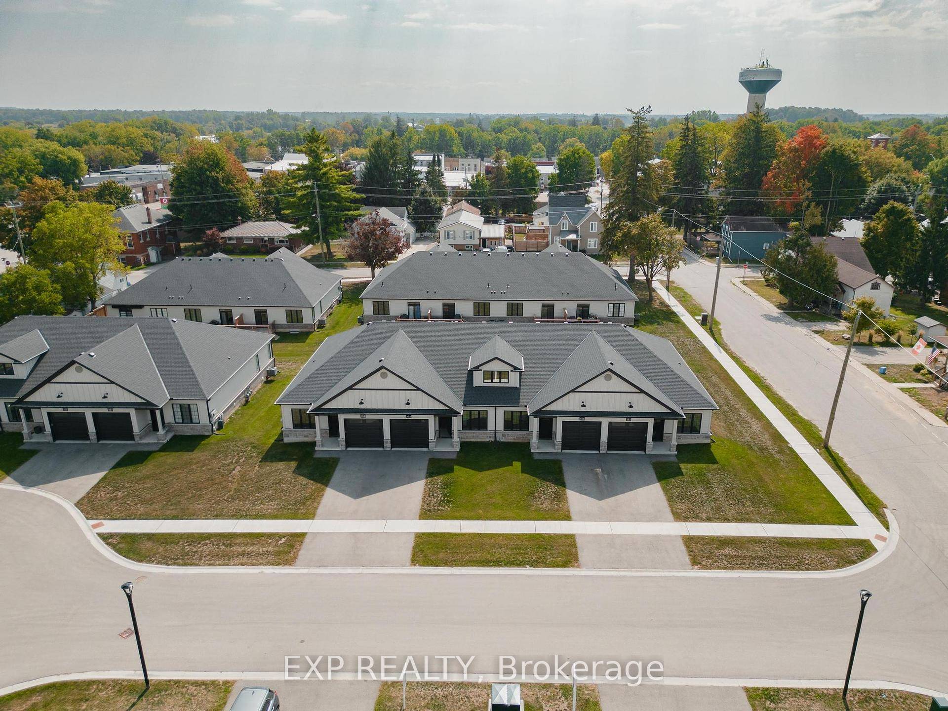 Discover the charm of low maintenance living in this stylish interior bungalow townhouse at 12 Washington St, Unit 102.