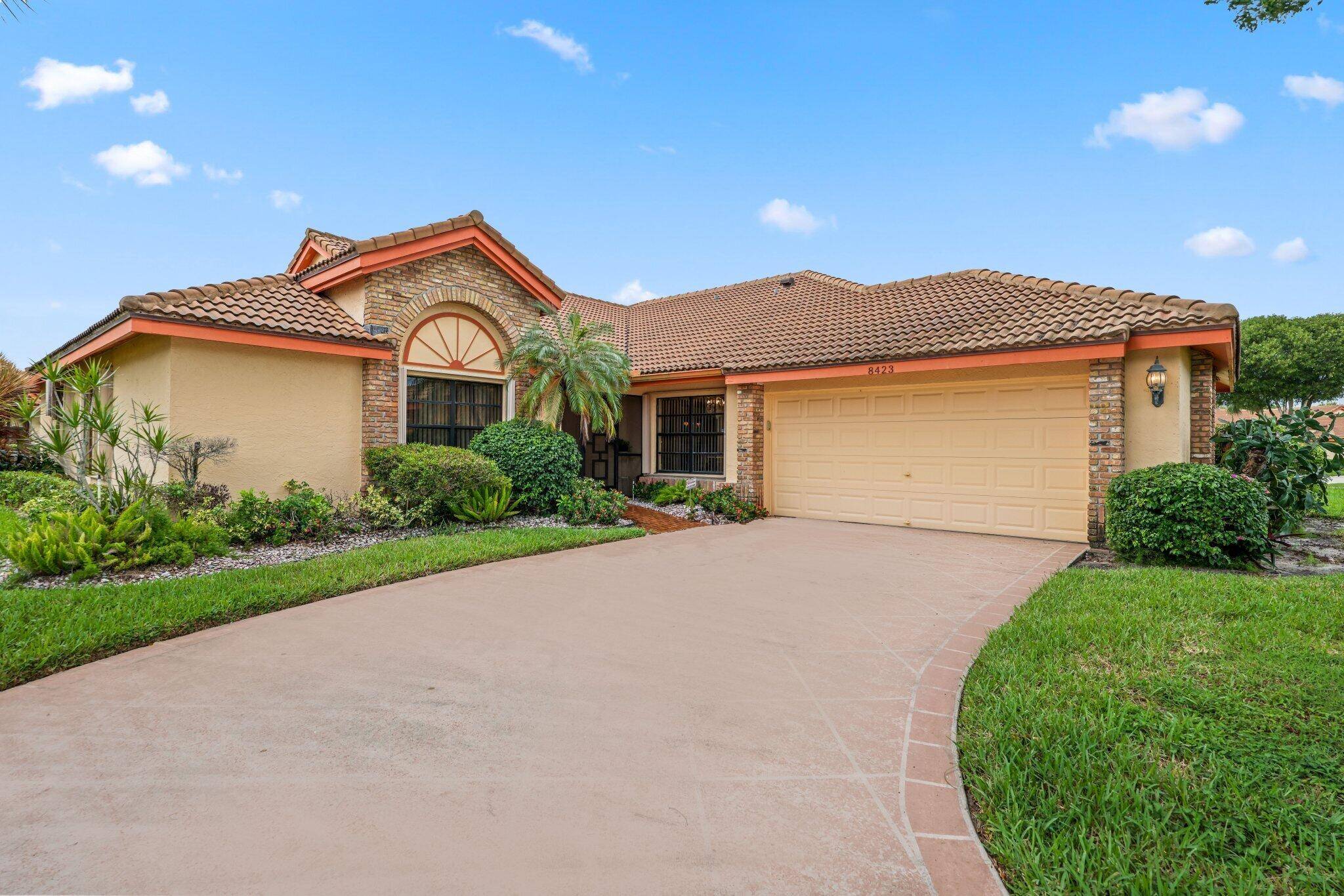Welcome to this spacious villa in Boynton Beach that offers the privacy and comfort of a single family home.